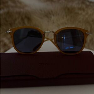 Oliver Peoples Amber Frame Sunglasses with Dark Lenses
